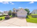 Charming two-story home features manicured lawn, neutral siding, and a convenient two-car garage at 6922 Brandon Chase Ln, Concord, NC 28025