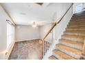 Inviting living room features a tiled floor, neutral paint, and access to a staircase at 6922 Brandon Chase Ln, Concord, NC 28025