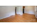 Spacious living room featuring hardwood floors, neutral walls, and ample natural light at 823 Yuma St, Charlotte, NC 28213