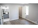 Bedroom view that leads into bathroom with modern sink and marbled shower at 830 Mcarthur Ave, Charlotte, NC 28206