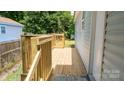 Side view of the house and the new wooden deck at 830 Mcarthur Ave, Charlotte, NC 28206