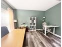 Inviting home office featuring modern décor, wood-look floors, and ample natural light at 9792 Ravenscroft Nw Ln, Concord, NC 28027