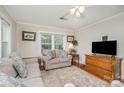 Cozy living room featuring hardwood floors, neutral paint, and natural light at 1006 Home Trl, Gastonia, NC 28052