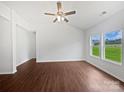Bright living room with wood floors and large windows offering plenty of natural light at 10328 Kempsford Dr, Charlotte, NC 28262