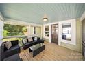 Cozy back porch with comfortable seating, ideal for outdoor relaxation and entertaining at 124 Marion St, Clover, SC 29710