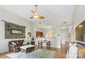 Cozy living room showcasing hardwood floors and an open layout leading to the kitchen area at 1315 East Blvd # 203, Charlotte, NC 28203