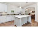 Bright kitchen featuring a center island, modern appliances, and hardwood flooring at 1593 Bloomfield Rd, Rock Hill, SC 29732