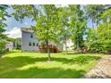Spacious, fenced backyard featuring a well-maintained lawn and mature trees at 169 Halifax Dr, Fort Mill, SC 29707