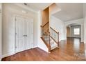 Spacious foyer with hardwood floors, staircase, and arched doorway at 169 Halifax Dr, Fort Mill, SC 29707