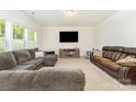 Spacious living room featuring comfortable seating, a large window, and a TV at 1691 Ashley Lynn Ct, Stanfield, NC 28163