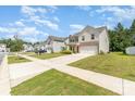 Neighborhood street view showcases well-maintained homes and manicured lawns at 1691 Ashley Lynn Ct, Stanfield, NC 28163