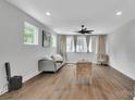 This living room features hardwood floors, recessed lighting, and an inviting sofa at 1933 W Trade St, Charlotte, NC 28216