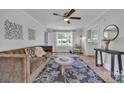 Bright living room boasts a ceiling fan, natural light, comfortable sofa, and stylish decor at 2222 19Th Ne Ave, Hickory, NC 28601