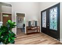 Elegant foyer with decorative front doors, hardwood floors, and a stylish console table at 240 Mark Ryan Ln, Dallas, NC 28034