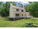 Attractive home showcasing a welcoming front porch and a manicured front yard at 308 Home Rd, Salisbury, NC 28147
