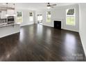 Spacious, open-concept living area featuring a fireplace and seamless flow into the kitchen at 3090 Bridgewater St, Lancaster, SC 29720