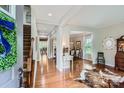 Bright foyer with hardwood floors and staircase, leading to the dining and living areas at 5056 Crandon Rd, Fort Mill, SC 29707