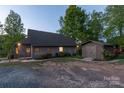 Exterior features include a shed, gravel driveway, and charming facade, adding character to the home at 639 Panther Point Trl, Richfield, NC 28137