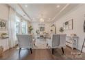 Bright and stylish home office with large windows, comfortable seating, and chic decor at 1178 Arges River Dr, Fort Mill, SC 29715