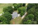 Scenic aerial view of the property surrounded by lush greenery, showcasing its tranquil and private setting at 121 C & K Dr # 60, Taylorsville, NC 28681