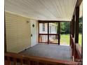 Cozy covered porch with wooden railings, perfect for relaxing and enjoying the outdoors at 121 C & K Dr # 60, Taylorsville, NC 28681