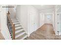Inviting entryway with hardwood floors and staircase, offering a glimpse into the home at 248 Miramar Dr, York, SC 29745