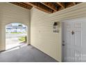 Condo patio showing door, unit number, and entry to outside at 4024 Town Center Rd, Harrisburg, NC 28075