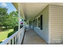 Relaxing porch with white railings and trim, offering a serene outdoor space at 5211 Spring Gln, York, SC 29745