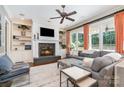Cozy living room with fireplace, built-in bookshelves, large windows, and comfortable seating at 5537 Challis View Ln, Charlotte, NC 28226