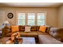 Inviting living room with a large sectional sofa and bright natural light at 701 Mcswain Rd, Shelby, NC 28150