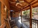 Relaxing covered porch with rocking chairs, offering a tranquil outdoor living space at 720 Potneck Rd, Salisbury, NC 28147