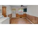 Cozy dining area features beadboard walls, updated flooring, and classic design at 807 Claremont Rd, Charlotte, NC 28214