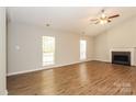 Spacious living room featuring vaulted ceilings, a cozy fireplace, and abundant natural light at 9000 Vagabond Rd, Charlotte, NC 28227