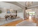 Spacious dining room with hardwood floors, a chandelier, and an elegant arched entryway at 11008 Strike The Gold Ln, Waxhaw, NC 28173