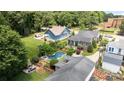 Expansive backyard with a pool, hot tub, and outdoor seating area, surrounded by mature trees at 117 N Central Ave, Belmont, NC 28012