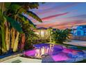 Lush backyard with a vibrant pool and beautiful landscaping creating a private oasis at 117 N Central Ave, Belmont, NC 28012