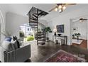 Bright room with large windows, spiral staircase, neutral colors, and stylish decor at 117 N Central Ave, Belmont, NC 28012