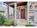 Charming front porch with brick accents and a painted front door, providing a warm welcome to visitors at 1314 San Gabriel Ave, Charlotte, NC 28214