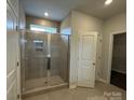 Bathroom with a large walk-in shower featuring a glass enclosure and tile surround at 156 Ella Claire Dr, York, SC 29745