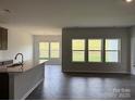 Open-concept kitchen and dining area with lots of natural light from large windows at 156 Ella Claire Dr, York, SC 29745