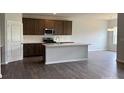Modern kitchen with stainless steel appliances and a large center island at 156 Ella Claire Dr, York, SC 29745