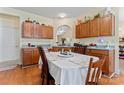 Cozy dining area adjacent to the kitchen, with wood cabinets and a view into another living space at 219 Mccord St, Charlotte, NC 28216