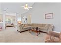 Open living room with neutral tones, plush carpet, and high ceilings for a cozy and inviting atmosphere at 219 Mccord St, Charlotte, NC 28216
