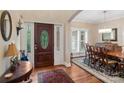 Inviting entryway with a decorative glass door, hardwood floors, and access to the dining room at 23 Tanglewood Rd, Clover, SC 29710