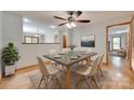 Stylish dining room with modern table, seating for six, and elegant decor at 25056 Timberlake Dr, Fort Mill, SC 29708