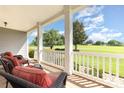 Inviting front porch features comfortable seating and picturesque views of manicured front yard at 3068 Green Acres Ln, Claremont, NC 28610