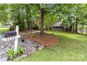 Manicured front yard featuring a mailbox and lush landscaping leading to the home at 3092 Hitching Post Ln, Rock Hill, SC 29732