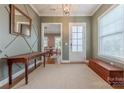 Inviting entryway showcasing elegant decor, natural light, and beautiful hardwood floors at 5256 Meadowcroft Way, Fort Mill, SC 29708