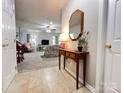 Spacious living room featuring neutral tones, carpeted floors, and an open layout perfect for entertaining at 5434 Starflower Dr, Charlotte, NC 28215
