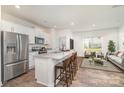 Modern kitchen with stainless steel appliances and a granite countertop island at 7109 N Mills Rd, Charlotte, NC 28216